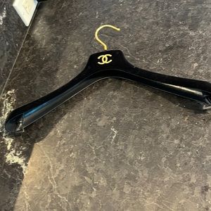 Chanel black velvet hanger.